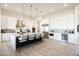 Modern kitchen with white cabinetry, stainless steel appliances, and a large center island with seating at 510 E Woburn Ln, Phoenix, AZ 85085