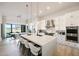 Spacious, modern kitchen features a large island with seating, pendant lights, and stainless steel appliances at 510 E Woburn Ln, Phoenix, AZ 85085