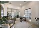 Bright home office with modern furniture, stylish decor, and natural light from a large window at 510 E Woburn Ln, Phoenix, AZ 85085