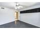 View of bedroom with a ceiling fan and a door leading to bathroom at 5501 E Camelback Rd, Phoenix, AZ 85018