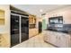 Kitchen featuring built in appliances, granite countertops, and ample cabinet space at 5501 E Camelback Rd, Phoenix, AZ 85018