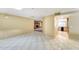 Open-concept living area with tile flooring, a skylight, and access to the kitchen and other living spaces at 5501 E Camelback Rd, Phoenix, AZ 85018