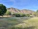 Scenic view of mountains in the background, enhancing the property's natural beauty and desirability at 5501 E Camelback Rd, Phoenix, AZ 85018