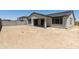 Spacious backyard with a covered patio and block wall at 5508 N 192Nd Ave, Litchfield Park, AZ 85340