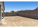 Spacious backyard with a brick wall, ready for landscaping at 5508 N 192Nd Ave, Litchfield Park, AZ 85340