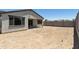 View of the spacious backyard and a covered patio at 5508 N 192Nd Ave, Litchfield Park, AZ 85340