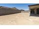 Spacious backyard with a covered patio and block wall at 5508 N 192Nd Ave, Litchfield Park, AZ 85340