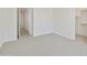 Bedroom showcasing neutral carpet, white walls and trim, and entrance to the walk-in closet at 5508 N 192Nd Ave, Litchfield Park, AZ 85340