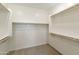 Walk-in closet with built-in shelving and hanging rods for ample storage and organization at 5508 N 192Nd Ave, Litchfield Park, AZ 85340