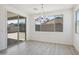 Bright dining area with a modern chandelier, and sliding glass door to the backyard at 5508 N 192Nd Ave, Litchfield Park, AZ 85340