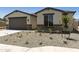 Well-maintained home with a two-car garage and drought-tolerant front yard at 5508 N 192Nd Ave, Litchfield Park, AZ 85340