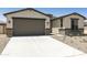 Lovely home featuring a convenient two-car garage and low-maintenance landscaping at 5508 N 192Nd Ave, Litchfield Park, AZ 85340