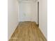 Bright and modern hallway with elegant wood-look flooring and neutral paint at 5508 N 192Nd Ave, Litchfield Park, AZ 85340