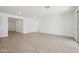 Open living area featuring wood-look tile flooring and a bright and spacious design at 5508 N 192Nd Ave, Litchfield Park, AZ 85340