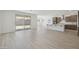 Bright living space featuring tiled floors, a dining area, and sliding glass doors at 5508 N 192Nd Ave, Litchfield Park, AZ 85340