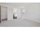 Spacious main bedroom with ensuite bathroom access featuring neutral carpet flooring at 5508 N 192Nd Ave, Litchfield Park, AZ 85340
