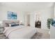 Serene main bedroom with a large bed, ensuite bathroom access, and neutral tones at 5508 N 192Nd Ave, Litchfield Park, AZ 85340