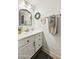 Cozy bathroom with white vanity, decorative mirror, and neutral-toned walls at 5704 E Aire Libre Ave # 1044, Scottsdale, AZ 85254