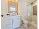 Stylish bathroom with a marble countertop, vanity with drawers, and a modern glass-enclosed shower at 5801 E Exeter Blvd, Phoenix, AZ 85018