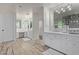 Bright bathroom with custom cabinets, dual vanities, and ample storage space, featuring elegant finishes at 5801 E Exeter Blvd, Phoenix, AZ 85018