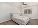 Bright bedroom with a neutral color palette, large window and ceiling fan at 5801 E Exeter Blvd, Phoenix, AZ 85018