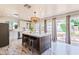 Bright, airy kitchen featuring stainless steel appliances, a marble island, and backyard views at 5801 E Exeter Blvd, Phoenix, AZ 85018