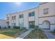 Inviting townhome exterior showcasing desert landscaping and white facade under a sunny sky at 5853 E Thomas Rd, Scottsdale, AZ 85251