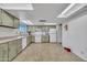 Bright kitchen with skylights, modern appliances, and stylish cabinetry, offering a functional and inviting cooking space at 635 W Pecos Ave, Mesa, AZ 85210