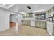 Bright kitchen featuring lots of storage, tiled flooring, and a nice view out the window at 635 W Pecos Ave, Mesa, AZ 85210