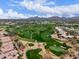 Picturesque aerial view showcases a golf course winding through an upscale residential neighborhood at 7525 E Gainey Ranch Rd # 110, Scottsdale, AZ 85258