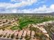 Stunning aerial view of the property surrounded by a lush golf course and neighborhood at 7525 E Gainey Ranch Rd # 110, Scottsdale, AZ 85258