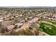 Serene aerial view of a residential community with lush green golf course and mountain views at 7525 E Gainey Ranch Rd # 110, Scottsdale, AZ 85258