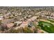 Aerial view of homes with pools situated next to a well-maintained golf course at 7525 E Gainey Ranch Rd # 110, Scottsdale, AZ 85258