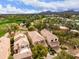 Beautiful aerial view of homes near the golf course with mountain views in the distance at 7525 E Gainey Ranch Rd # 110, Scottsdale, AZ 85258