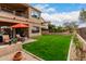 Expansive backyard featuring a well-maintained lawn, patio area, and mature landscaping at 7525 E Gainey Ranch Rd # 110, Scottsdale, AZ 85258