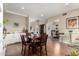 Open-concept dining area featuring hardwood floors, neutral decor, and seamless transition to other living spaces at 7525 E Gainey Ranch Rd # 110, Scottsdale, AZ 85258