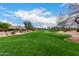 Picturesque view of the golf course and surrounding homes in a golf community at 7525 E Gainey Ranch Rd # 110, Scottsdale, AZ 85258