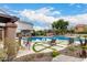 Community pool and patio featuring lounge chairs and lush landscaping at 7525 E Gainey Ranch Rd # 110, Scottsdale, AZ 85258