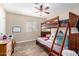 Bedroom with bunk bed, dresser, and closet at 8431 W Planada Ln, Peoria, AZ 85383