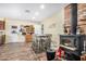 Dining area with brick fireplace and wood floors at 8431 W Planada Ln, Peoria, AZ 85383