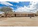 Ranch-style home with neutral paint, a two-car garage, and a desert landscape at 8431 W Planada Ln, Peoria, AZ 85383