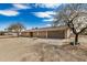 Ranch-style home with neutral paint, a two-car garage, and a desert landscape at 8431 W Planada Ln, Peoria, AZ 85383