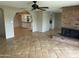 Open concept living area with brick fireplace and easy access to the kitchen at 8601 E Berridge Ln, Scottsdale, AZ 85250