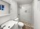 Modern bathroom featuring a sleek vanity, a toilet, and a beautifully tiled walk-in shower at 901 W 16Th St, Tempe, AZ 85281