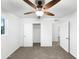 Bedroom featuring plush carpet flooring, ceiling fan, closets, and bright natural light at 901 W 16Th St, Tempe, AZ 85281