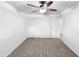 Bright bedroom featuring neutral carpet, a ceiling fan, and ample closet space at 901 W 16Th St, Tempe, AZ 85281