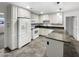 Modern kitchen featuring white cabinets, stainless steel appliances, and a kitchen island at 901 W 16Th St, Tempe, AZ 85281