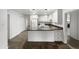 Bright kitchen featuring white cabinets, a kitchen island, and modern appliances for a seamless cooking experience at 901 W 16Th St, Tempe, AZ 85281