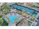 Aerial view of community pool, spa, and tennis courts surrounded by palm trees at 9113 N 116Th Way, Scottsdale, AZ 85259