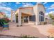 Beautiful backyard with sliding glass doors, a large patio, and neutral toned exterior at 9113 N 116Th Way, Scottsdale, AZ 85259